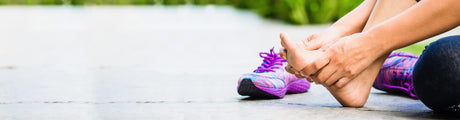 Image of Person Massaging the Arch of  Feet.