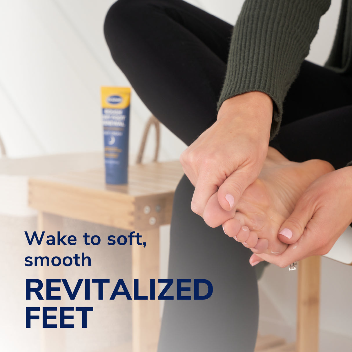 Hands applying a yellow foot sleeve with Dr. Scholl's overnight treatment tube
