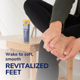 Hands applying a yellow foot sleeve with Dr. Scholl's overnight treatment tube