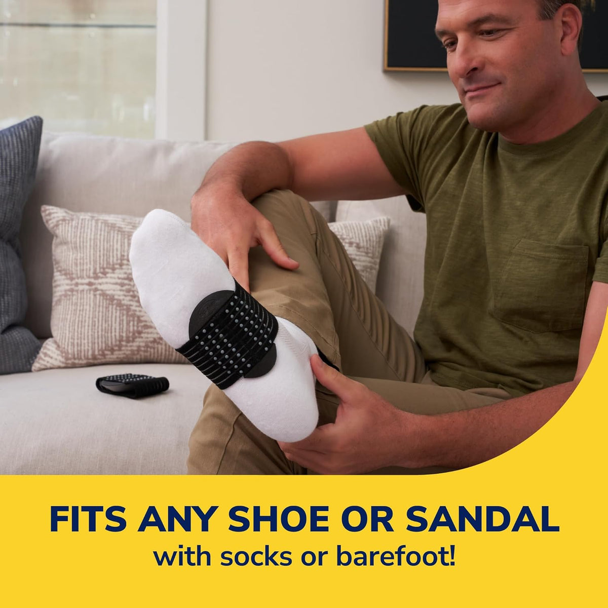 Black arch support sleeve on foot, cushioned arch pad and textured non-slip base