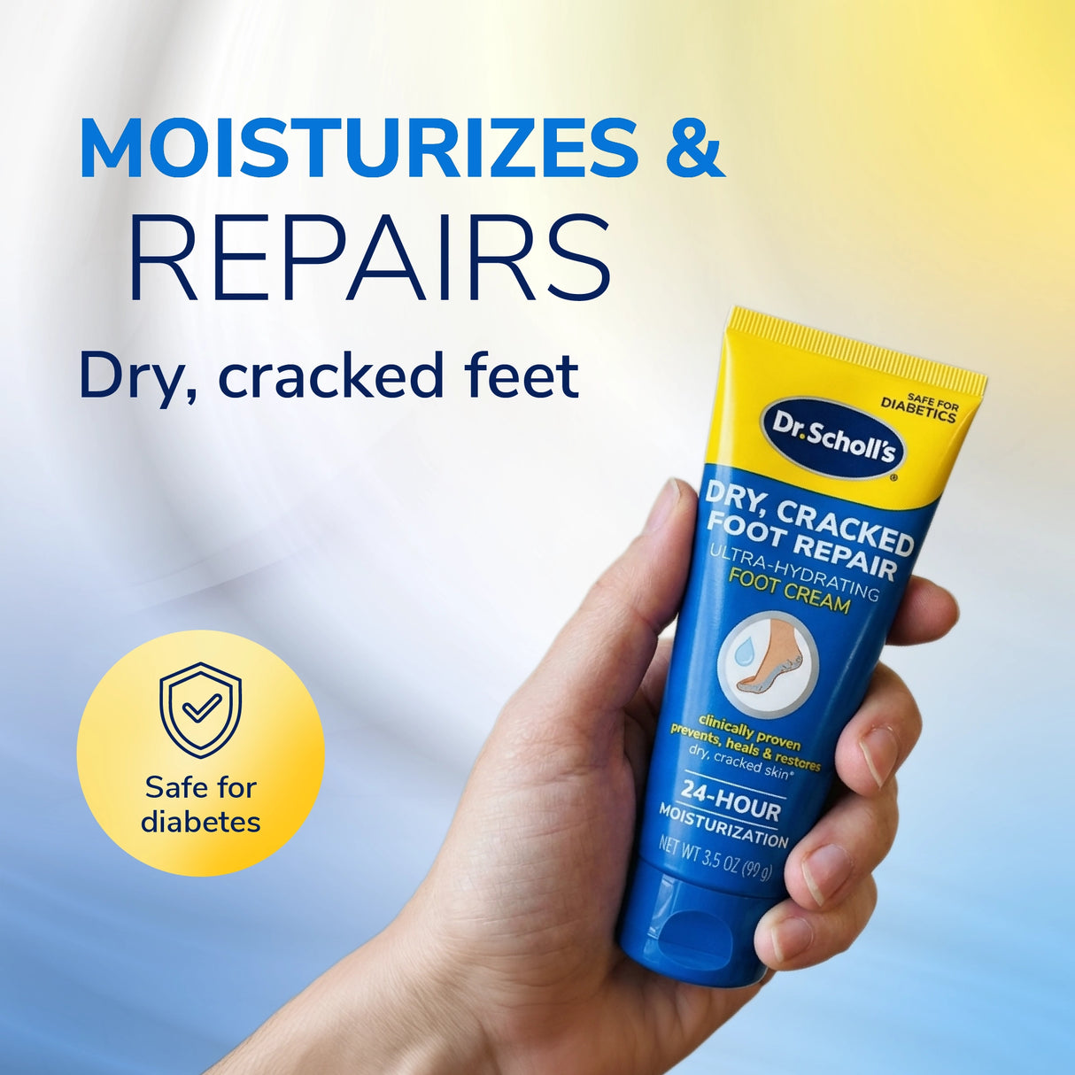 Hand holding Dr. Scholl's ultra-hydrating foot cream tube for dry, cracked feet