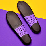 Pair of dark sneaker insoles with purple ventilation slots and cushioning top