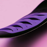 Close-up of purple cushioning ridges on sneaker insole surface