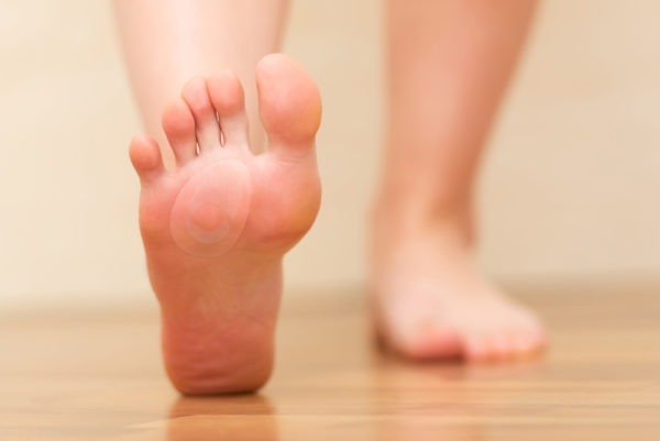 Image of a Person's Foot with a Dr.  Scholl's Callus Cushion.