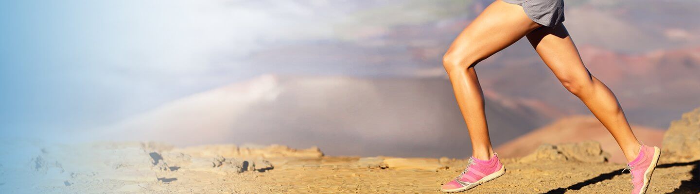 Image of person jogging in pink  shoes. 