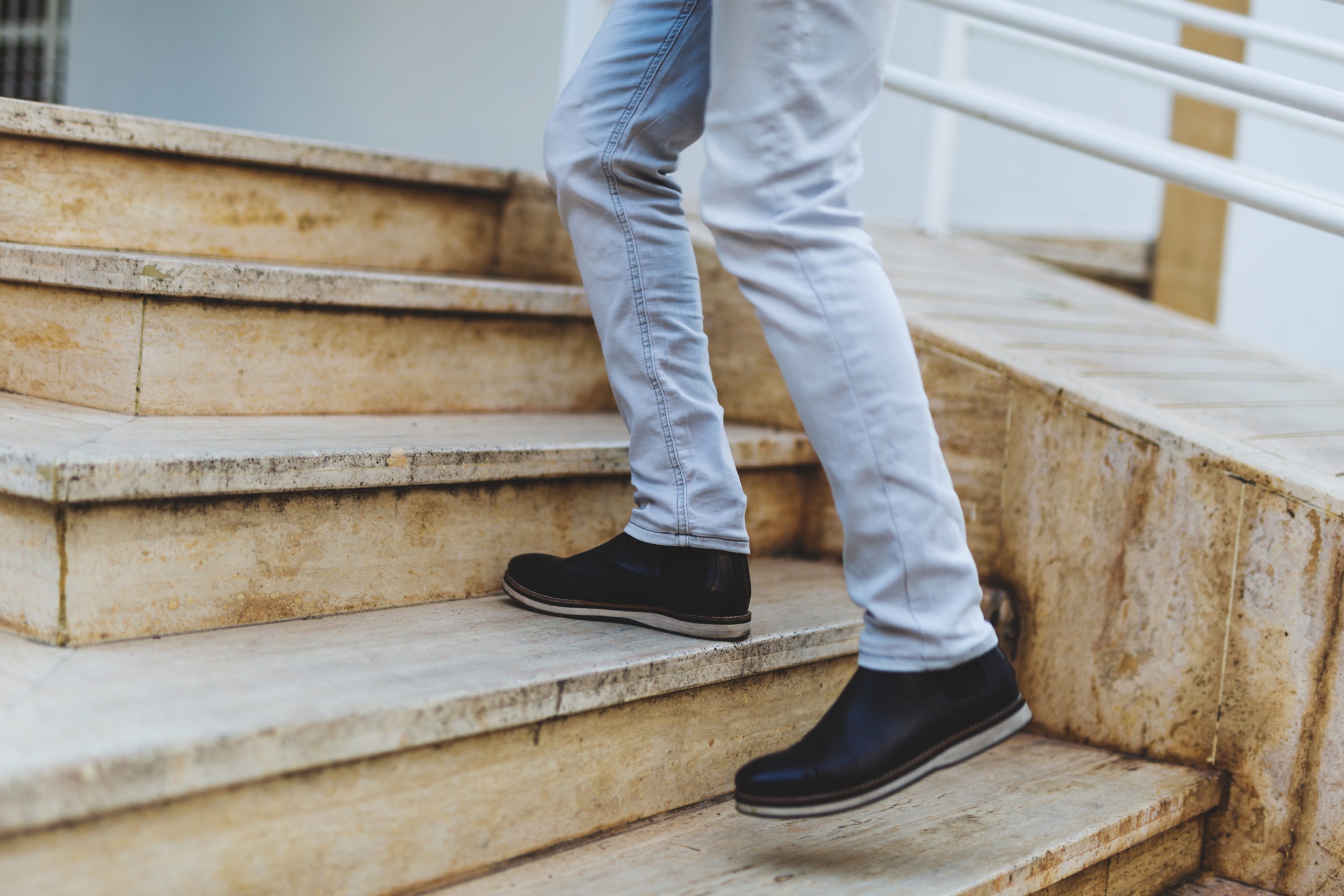 Image of Person walking up the Steps with Dr. Scholl's Insoles.