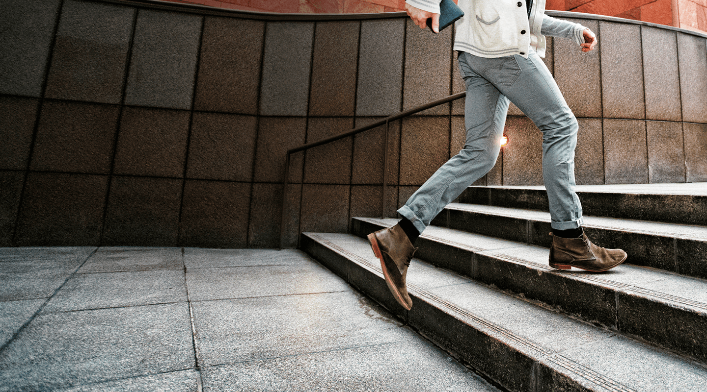 Photo of someone walking up stairs.