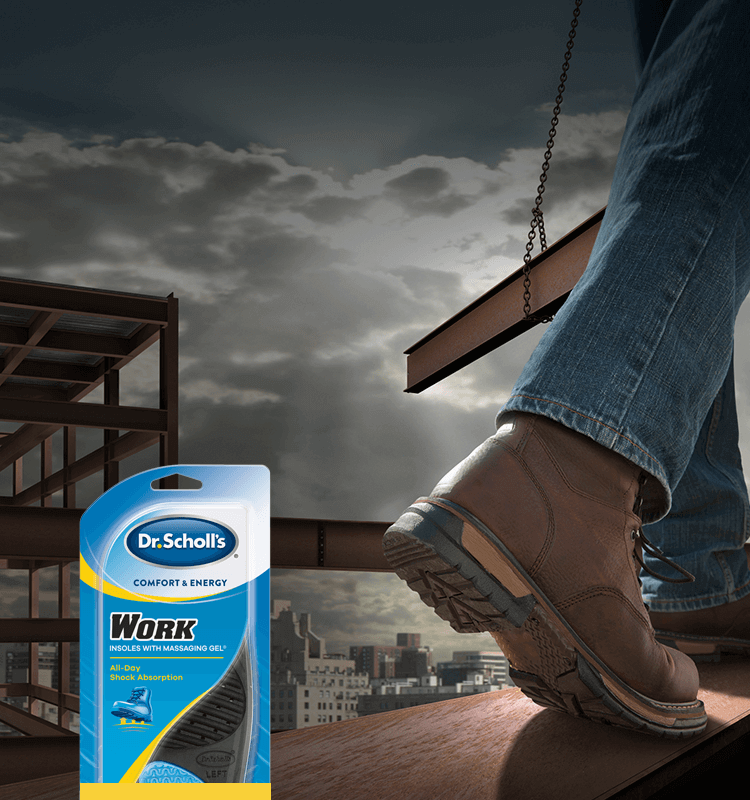 Closeup of someone in workboots walking on a girder.